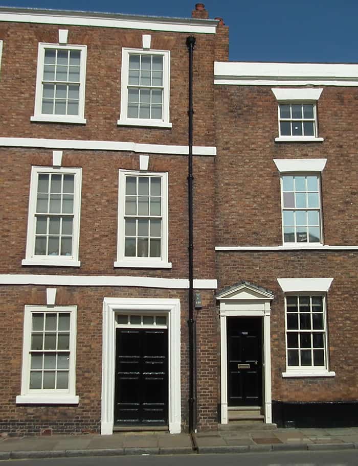 A photograph of a late 17th century terraced house sitting next to a late 18th century terraced house