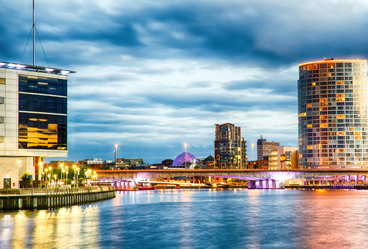 Belfast skyline at night over the River Lagan.