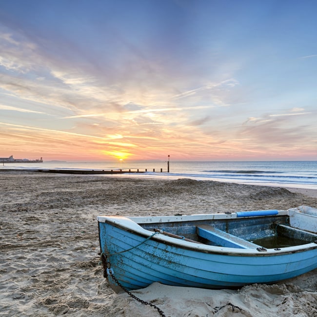 Fishing boat at sunrise off the Bournemouth coast