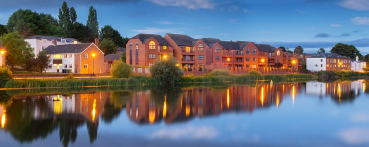 Residential street beside the river in Exeter at dusk