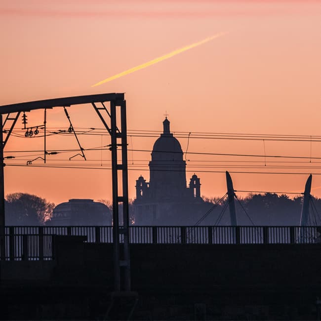 Silhouette of the Ashton Memorial in Williamson Park against a Lancaster sunset
