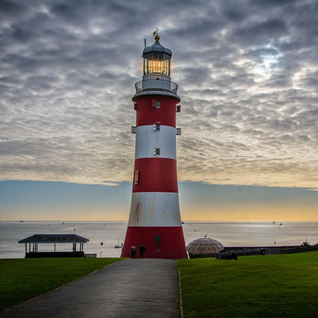 Smeaton's Tower lighthouse on Plymouth Hoe at sunset