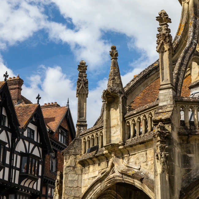The Poultry Cross with a Tudor-era timber-framed building behind it in Salisbury