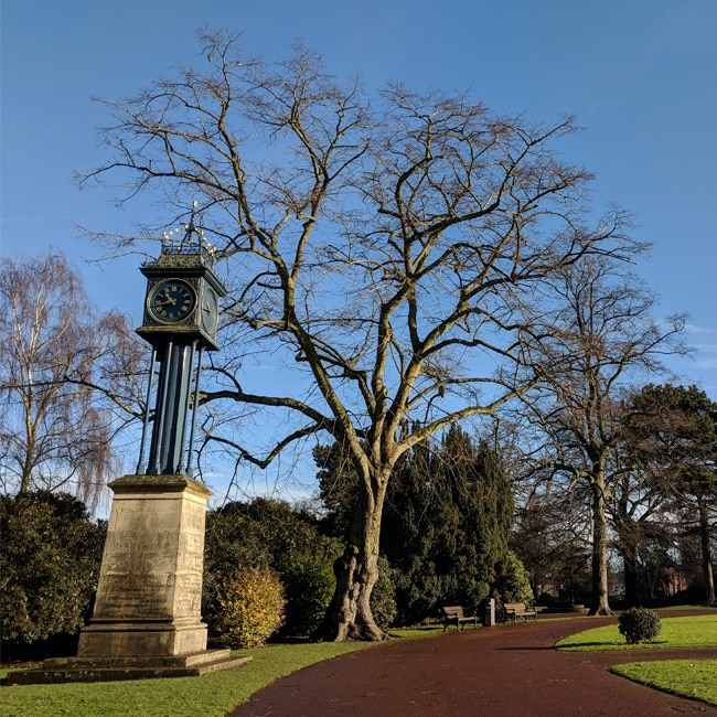 A small clocktower and a leafless tree in West Park, Wolverhampton