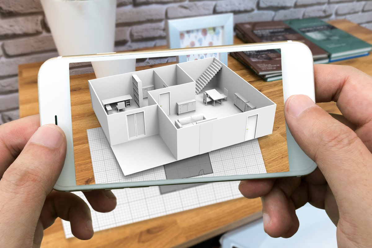 A demonstration of augmented reality. 2d architectural plans are transformed into a 3 dimensional building on a phone screen.