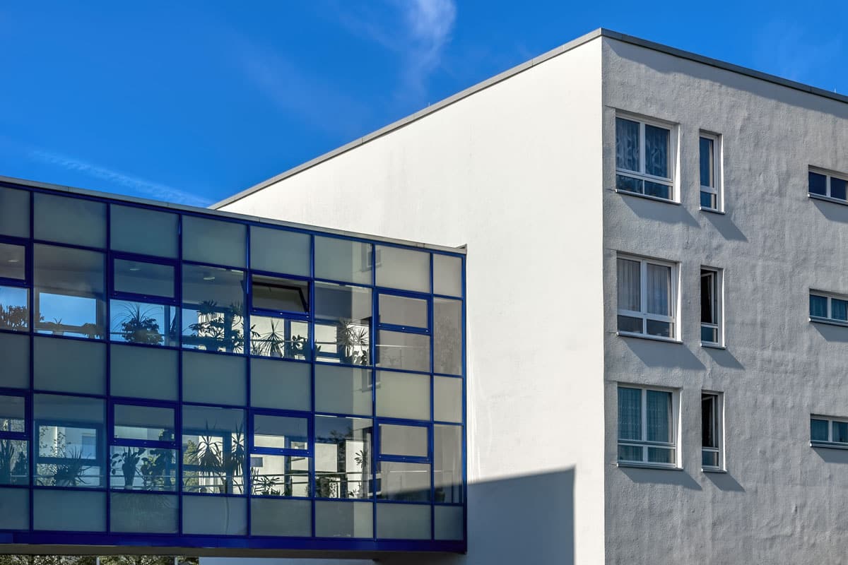 A two level glass corridor between two buildings.